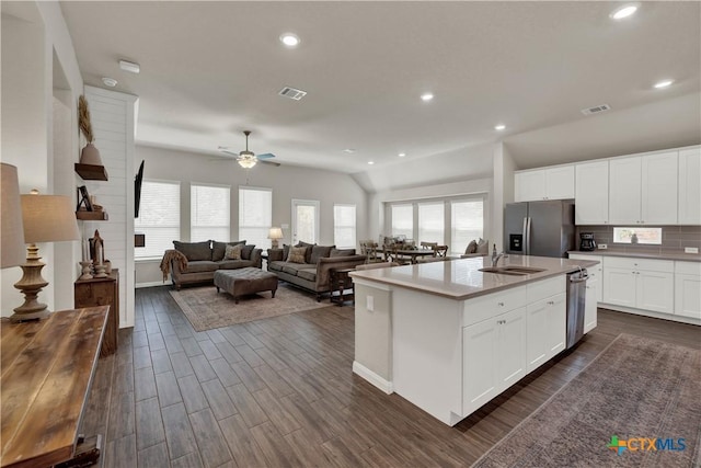 6010 Ballast Trl, New Braunfels, TX 78132 - kitchen with appliances with stainless steel finishes, a sink, dark wood-style floors, ceiling fan, and lofted ceiling