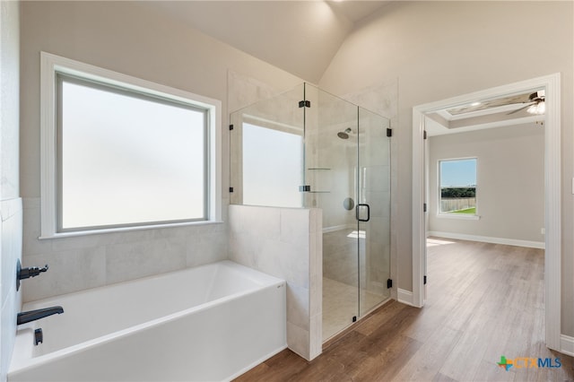 bathroom featuring independent shower and bath, lofted ceiling, hardwood / wood-style flooring, and ceiling fan