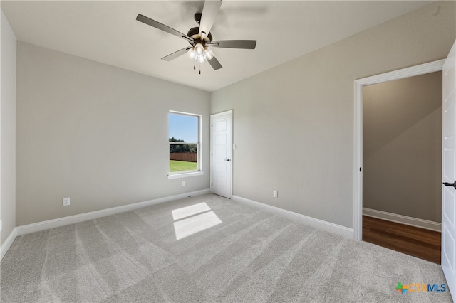 unfurnished bedroom featuring carpet and ceiling fan