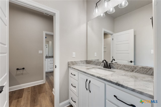 bathroom featuring vanity and hardwood / wood-style floors