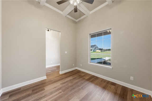 empty room with hardwood / wood-style floors, ceiling fan, and crown molding