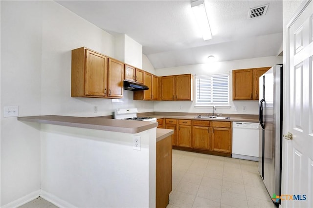 kitchen with sink, range, stainless steel refrigerator with ice dispenser, white dishwasher, and kitchen peninsula