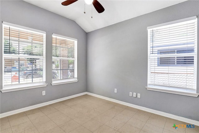 unfurnished room with ceiling fan and vaulted ceiling