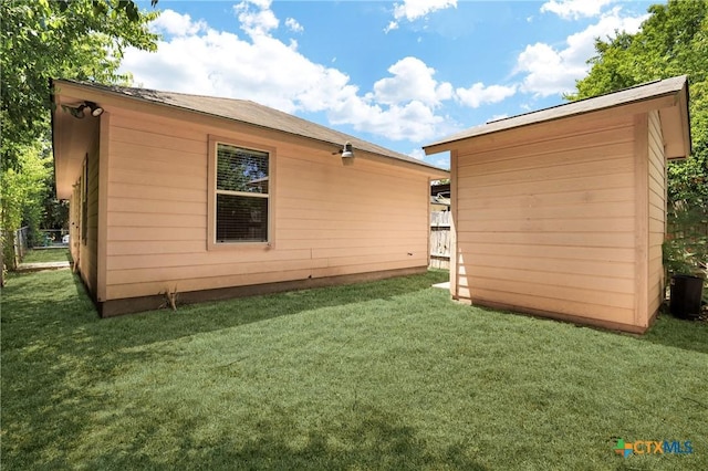 view of property exterior with a yard