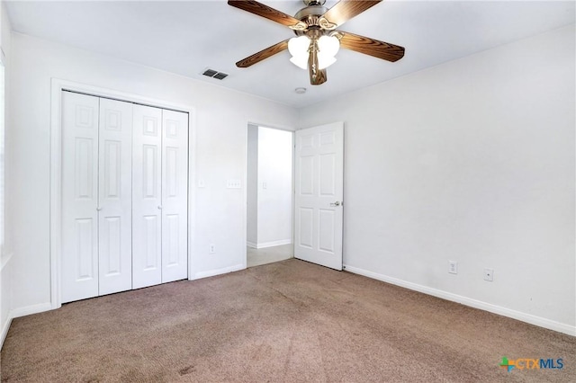 unfurnished bedroom featuring carpet flooring, ceiling fan, and a closet