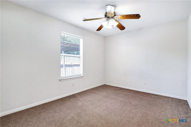 unfurnished room with carpet flooring and ceiling fan