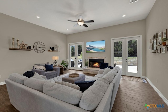 living room with ceiling fan, dark wood-style flooring, french doors, and plenty of natural light