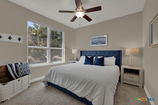 bedroom featuring carpet, a ceiling fan, and baseboards
