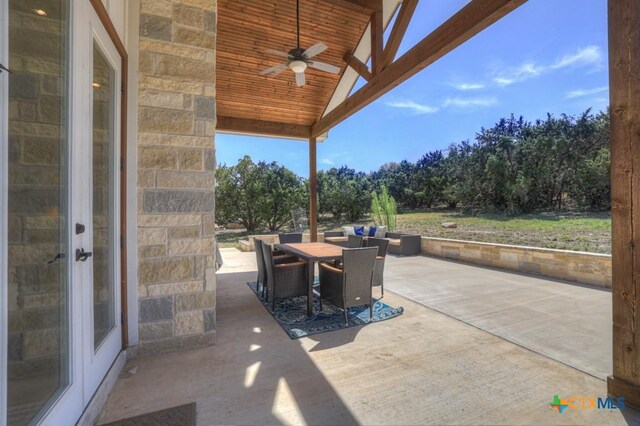 view of patio / terrace with ceiling fan and outdoor dining space