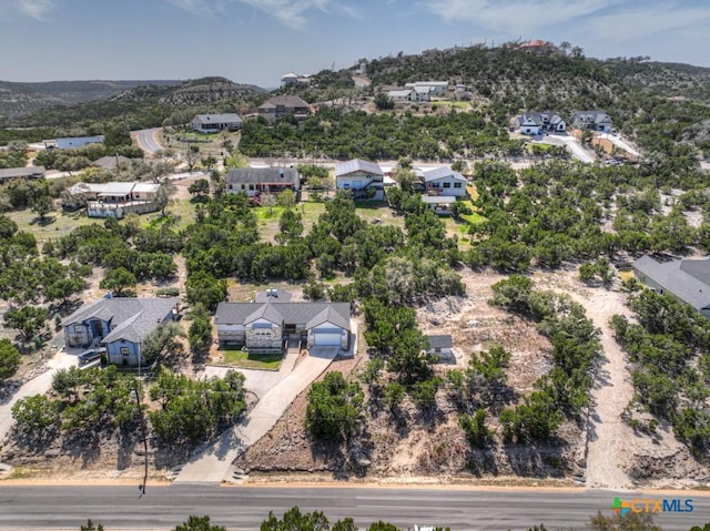 birds eye view of property with a residential view
