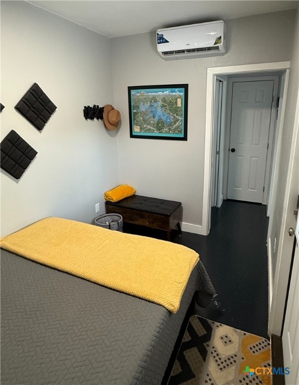 1131 Glenn Dr, Canyon Lake, TX 78133 - bedroom with a wall mounted AC and dark wood finished floors