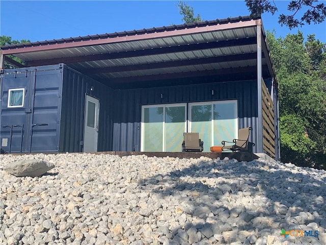 1131 Glenn Dr, Canyon Lake, TX 78133 - view of property exterior with board and batten siding