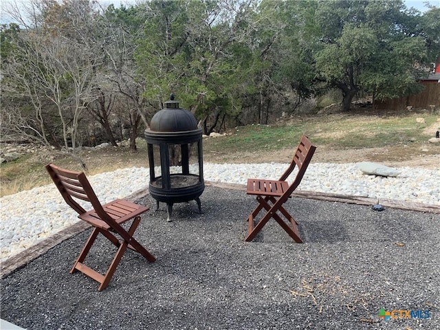 1131 Glenn Dr, Canyon Lake, TX 78133 - view of patio with an outdoor fire pit
