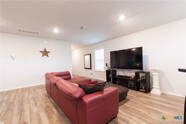 living room with light hardwood / wood-style floors