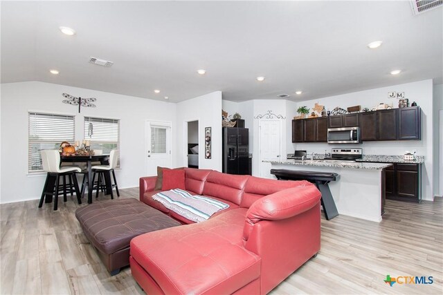 348 Jacquard Ct, Troy, TX 76579 - living room featuring light wood-type flooring and lofted ceiling