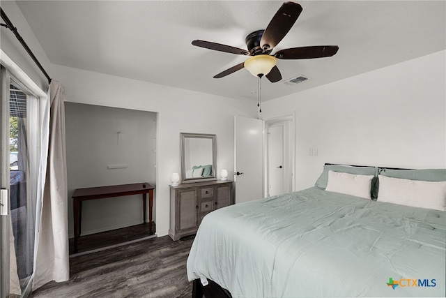 bedroom featuring dark wood-type flooring and ceiling fan