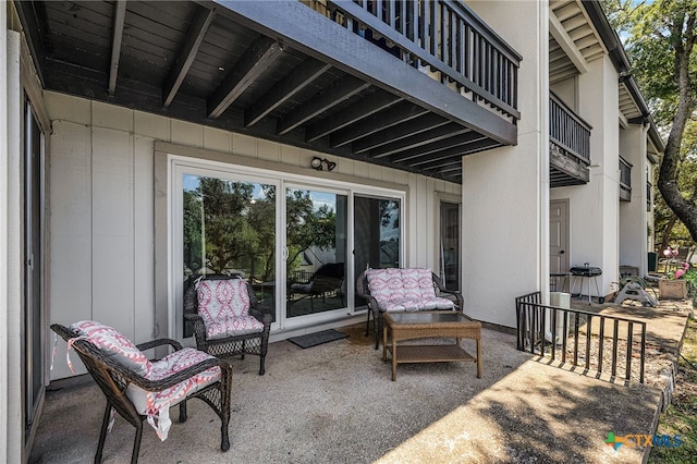 view of patio featuring a balcony