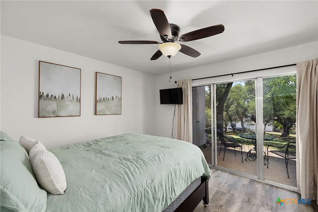 bedroom featuring access to outside, ceiling fan, and light hardwood / wood-style flooring