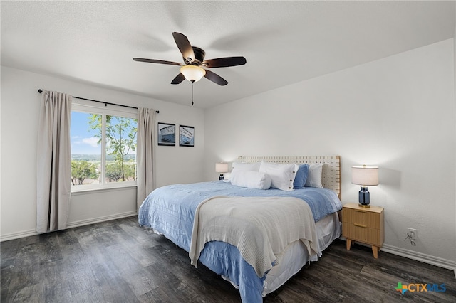 bedroom with dark wood-type flooring and ceiling fan