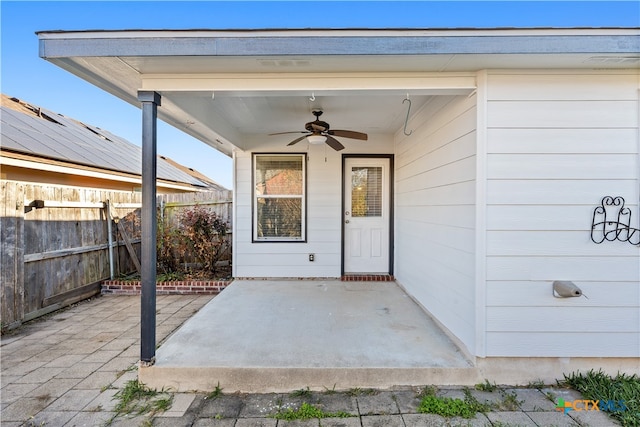 property entrance with ceiling fan and a patio