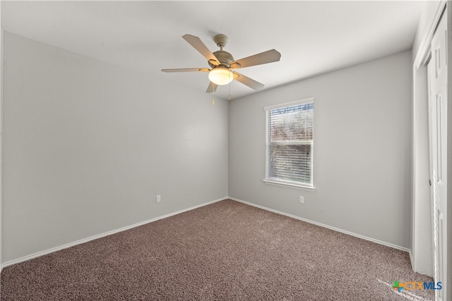 interior space featuring carpet flooring and ceiling fan