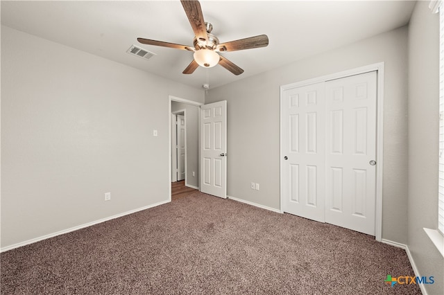 unfurnished bedroom with carpet floors, a closet, and ceiling fan