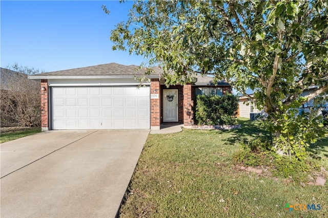 ranch-style home featuring a front yard and a garage