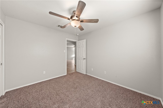 unfurnished bedroom with ceiling fan and carpet floors