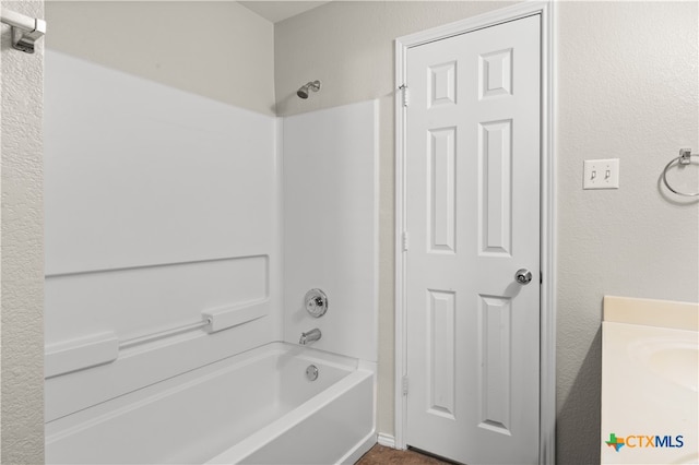 bathroom featuring vanity and tub / shower combination