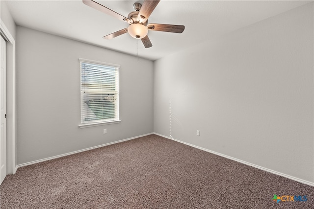 spare room with carpet flooring and ceiling fan