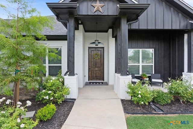 100 Metheglin Dr, Temple, TX 76502 - view of exterior entry featuring board and batten siding and brick siding