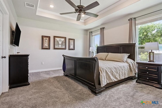 100 Metheglin Dr, Temple, TX 76502 - carpeted bedroom with a raised ceiling, ornamental molding, a ceiling fan, and recessed lighting