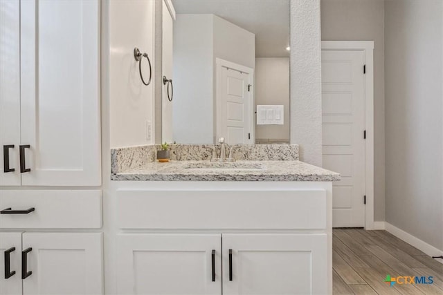 100 Metheglin Dr, Temple, TX 76502 - bathroom featuring vanity and wood finished floors