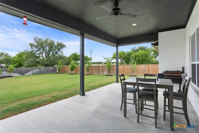 100 Metheglin Dr, Temple, TX 76502 - fenced backyard featuring ceiling fan, a patio, and outdoor dining space