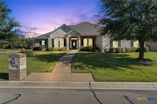 view of front of home with a lawn