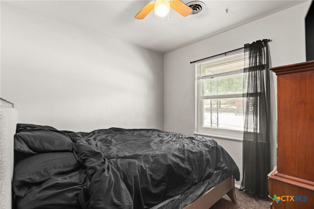 603 S 13th St, Copperas Cove, TX 76522 - bedroom with dark carpet and a ceiling fan