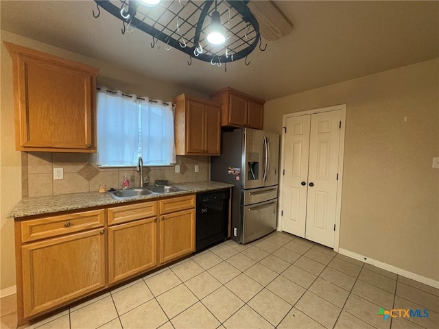 kitchen with stainless steel fridge, backsplash, sink, light tile patterned floors, and dishwasher