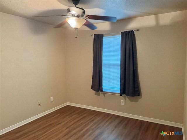 spare room with ceiling fan, wood-type flooring, and a textured ceiling