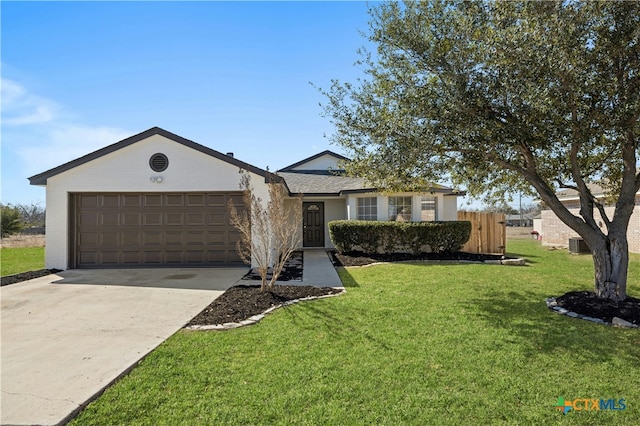 ranch-style home with an attached garage, central air condition unit, fence, driveway, and a front yard