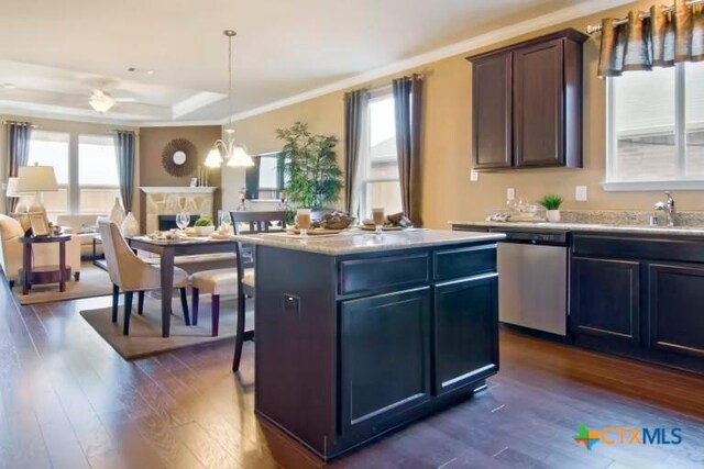 1575 Laila Ln, Belton, TX 76513 - kitchen with dishwasher, a sink, light countertops, dark wood finished floors, and a raised ceiling