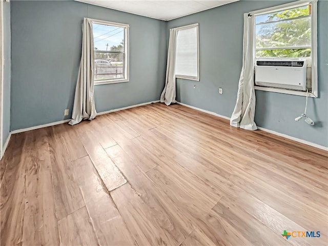 1805 E N St, Victoria, TX 77901 - spare room featuring wood finished floors and cooling unit