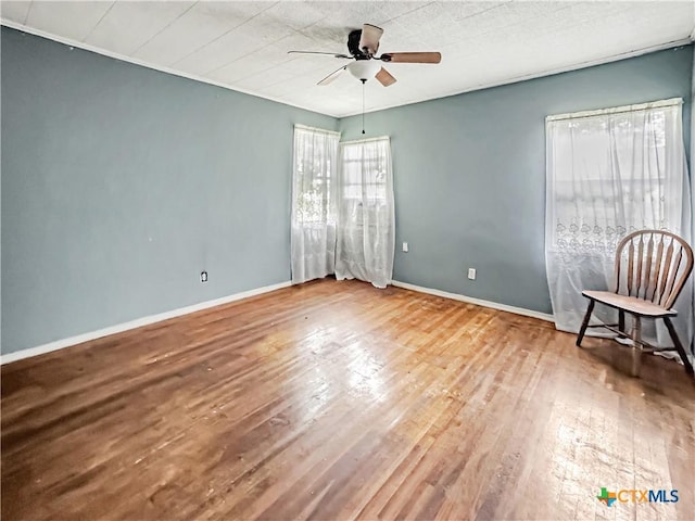1805 E N St, Victoria, TX 77901 - spare room featuring ceiling fan and wood finished floors