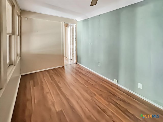 1805 E N St, Victoria, TX 77901 - unfurnished bedroom featuring wood finished floors and ceiling fan