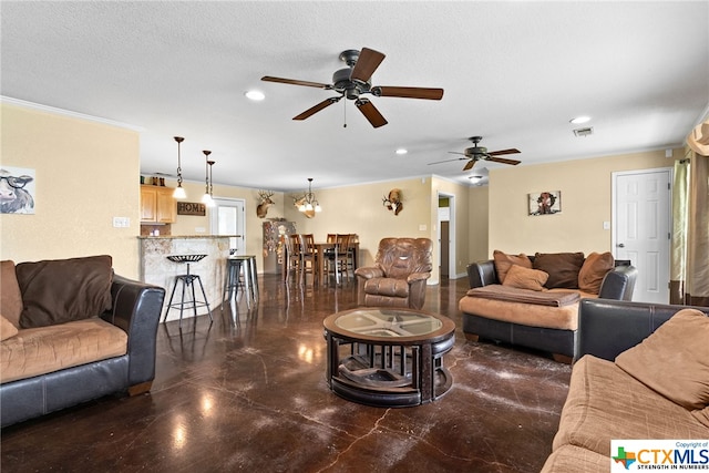 living room with ornamental molding, ceiling fan with notable chandelier, and a textured ceiling