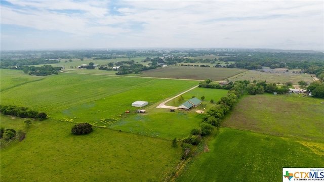 birds eye view of property featuring a rural view