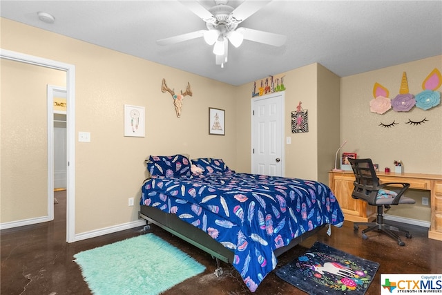 bedroom featuring built in desk and ceiling fan