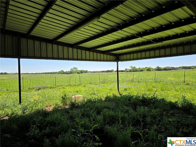 view of yard with a rural view