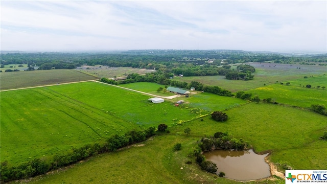 aerial view with a water view and a rural view