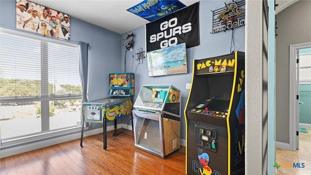 game room featuring wood finished floors and baseboards