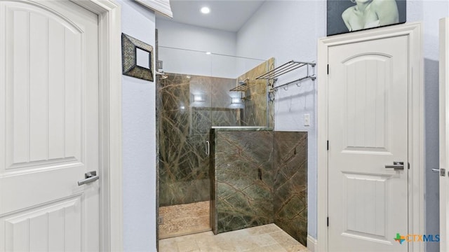 full bathroom with a marble finish shower